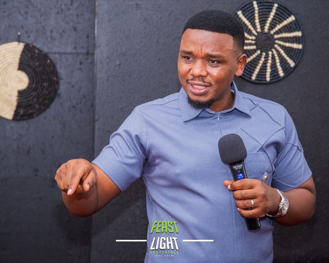 Pastor Paul Kateregga speaking at Feast of Light